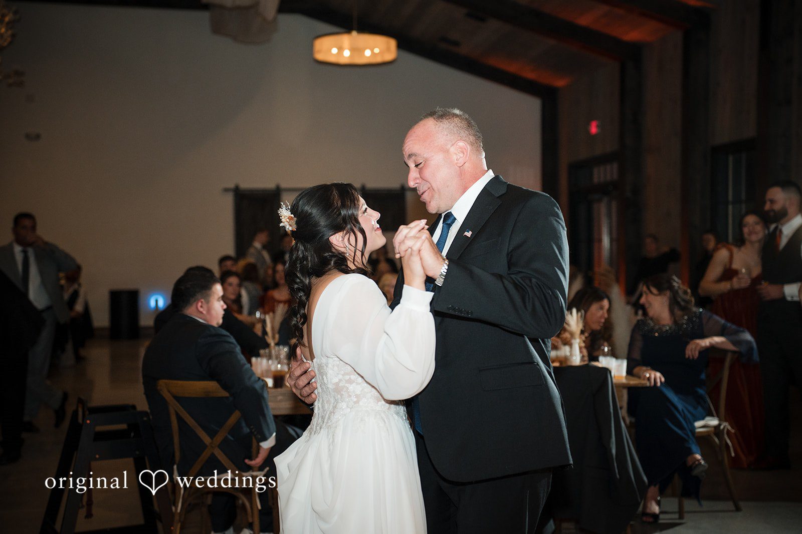 Carolyn + Robert Bride dancing with an older male guest during the reception.