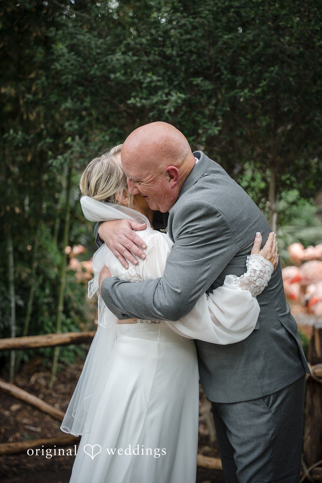Lorene + Brad Groom embracing the bride in a full-length portrait