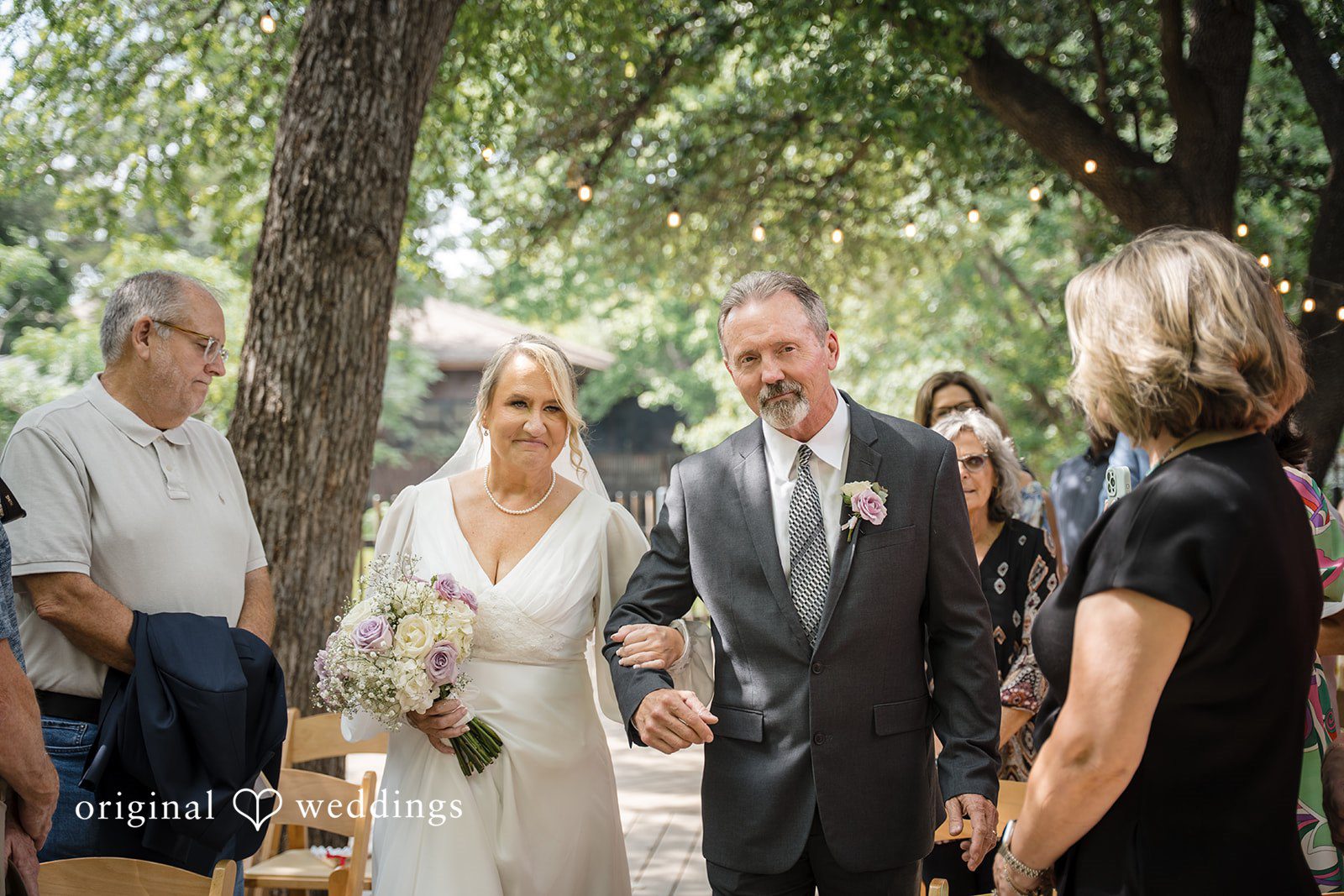 Lorene + Brad Bride and groom walking to the ceremony with a sibling