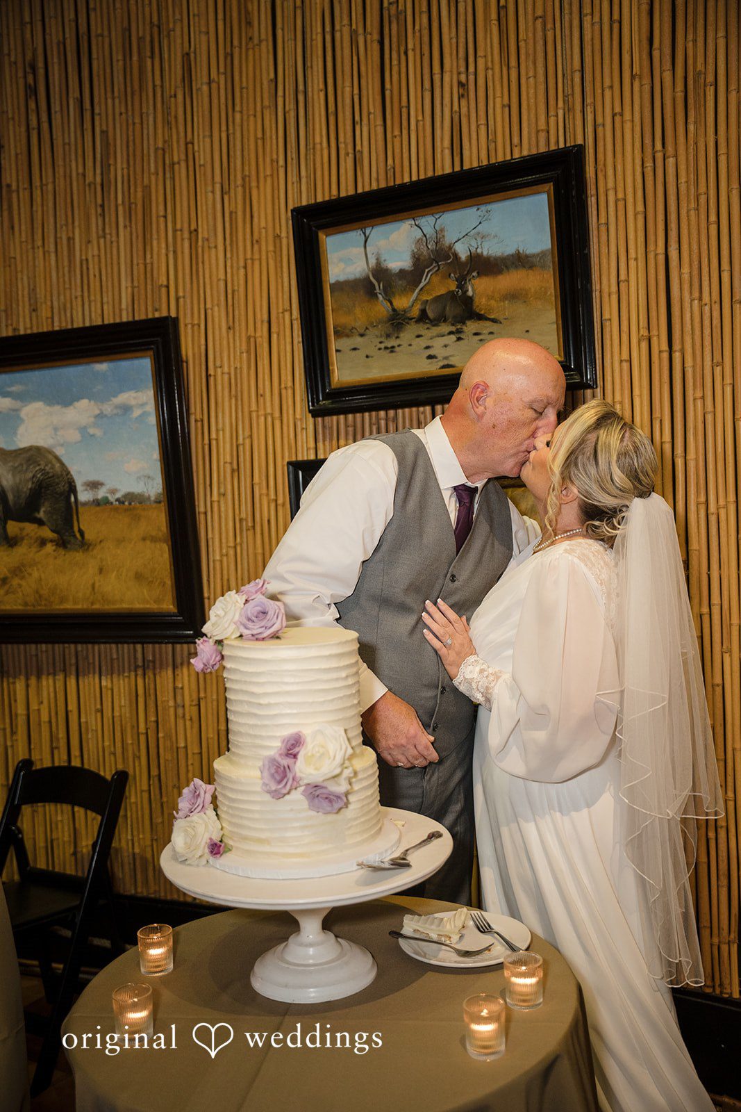 Lorene + Brad Newlyweds laughing after cutting the wedding cake