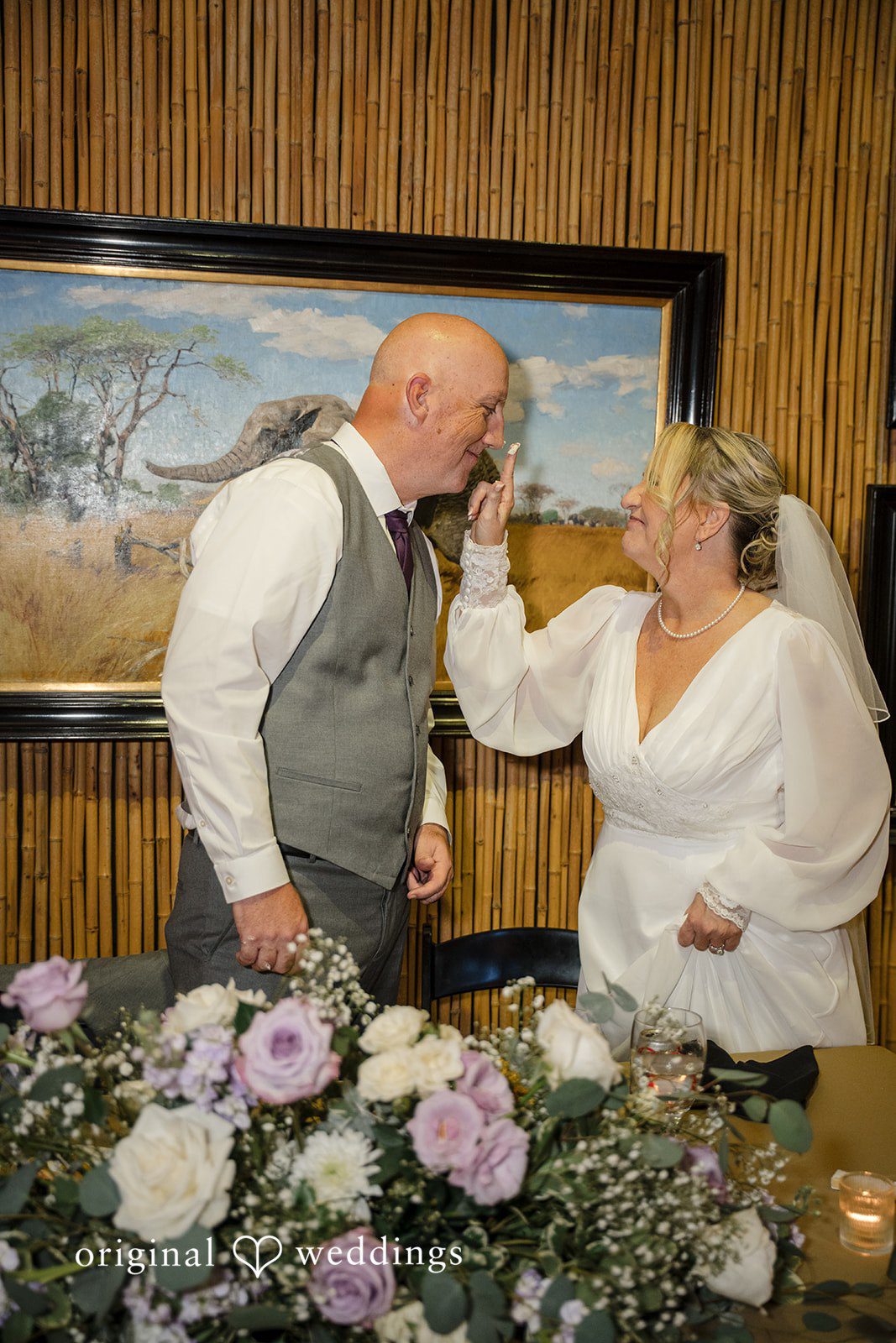 Lorene + Brad Bride and groom feeding each other wedding cake