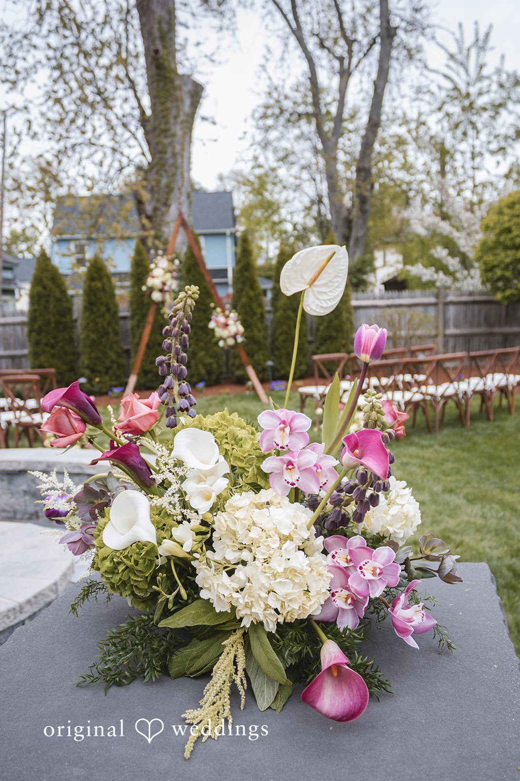 Matthew + Katie Close-up of floral arrangements on the reception table