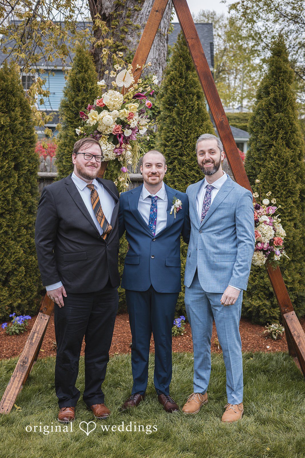 Matthew + Katie Groom posing with his friends before the ceremony