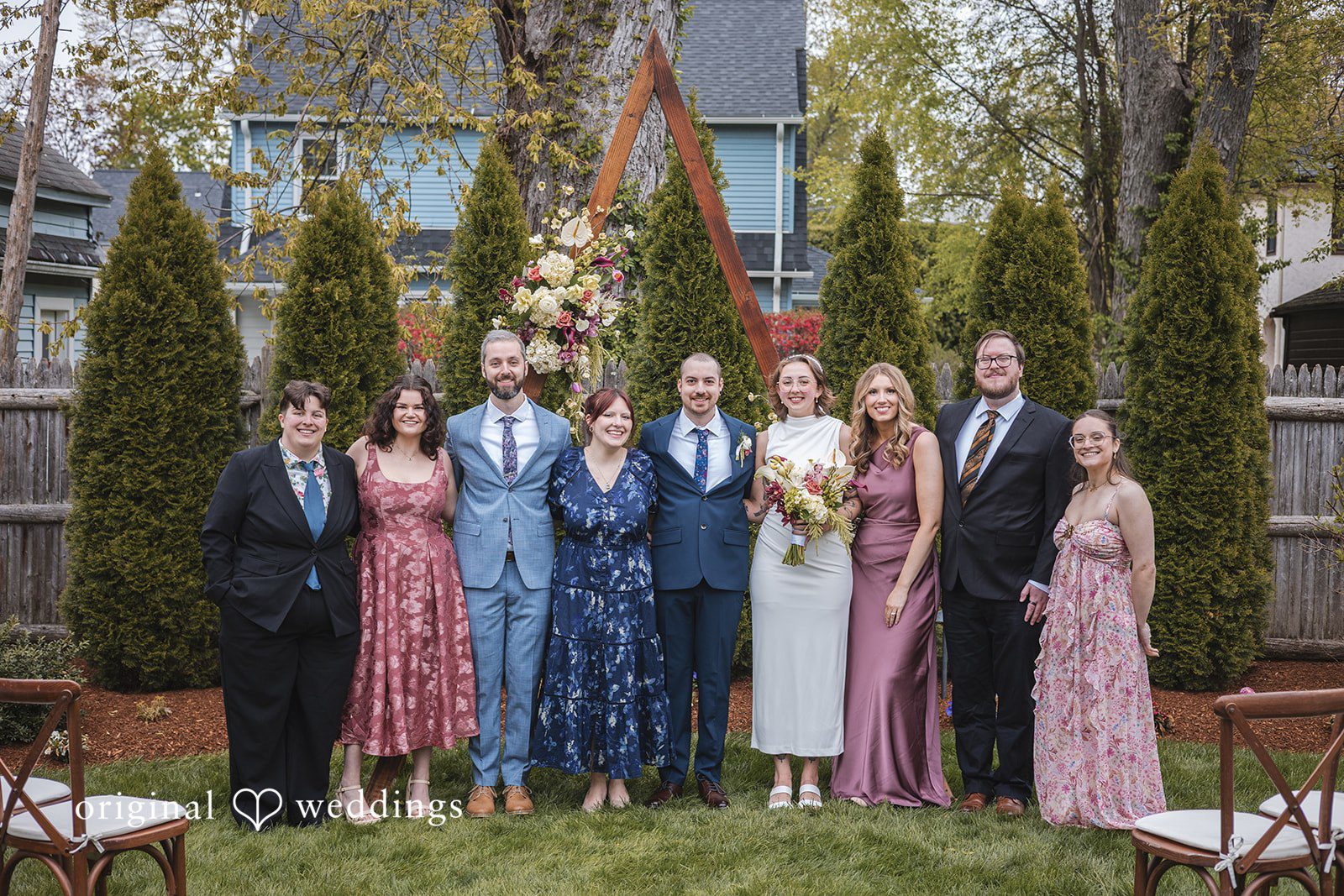 Matthew + Katie Bride and groom posing with wedding guests after the ceremony