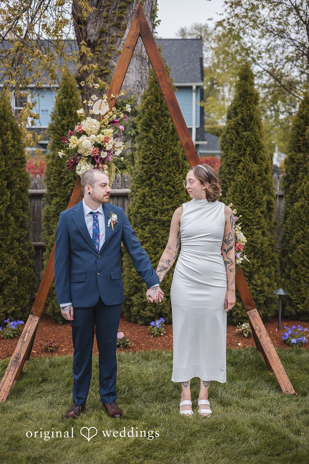 Matthew + Katie Full-length portrait of the couple holding hands outdoors