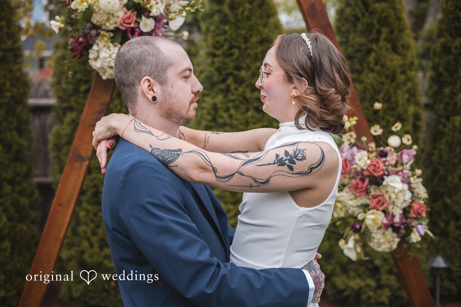 Matthew + Katie Bride and groom embracing during romantic wedding portraits