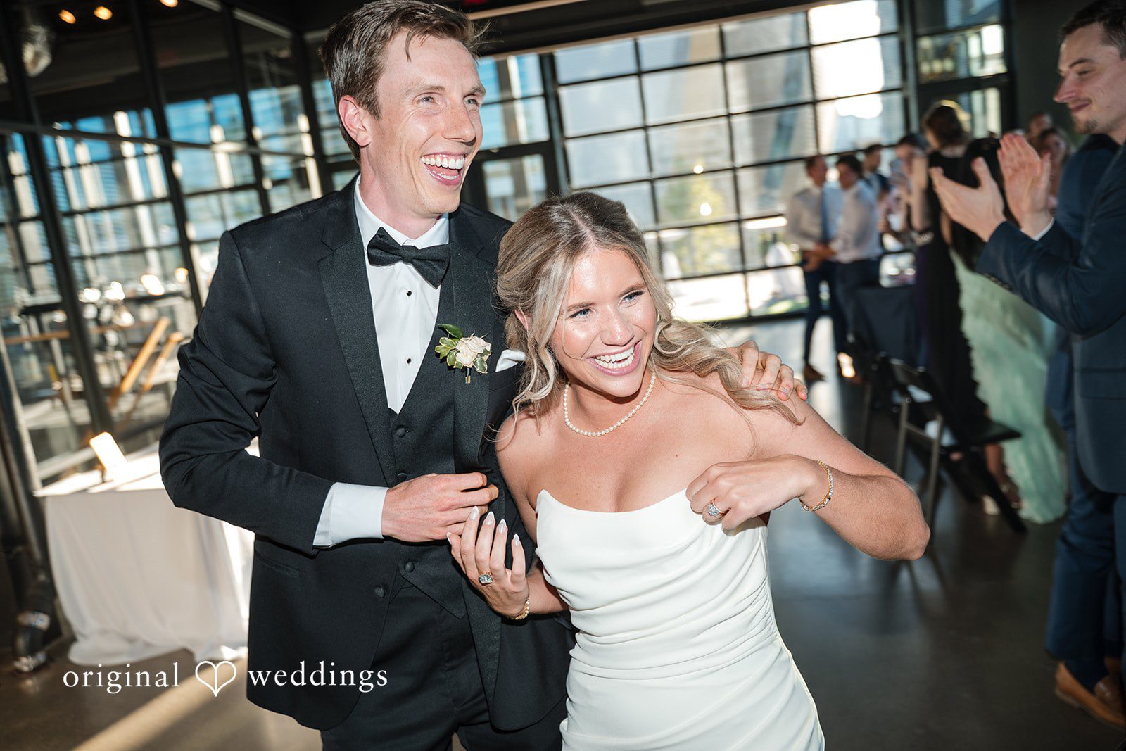 Bride and groom sharing joyful moments with guests