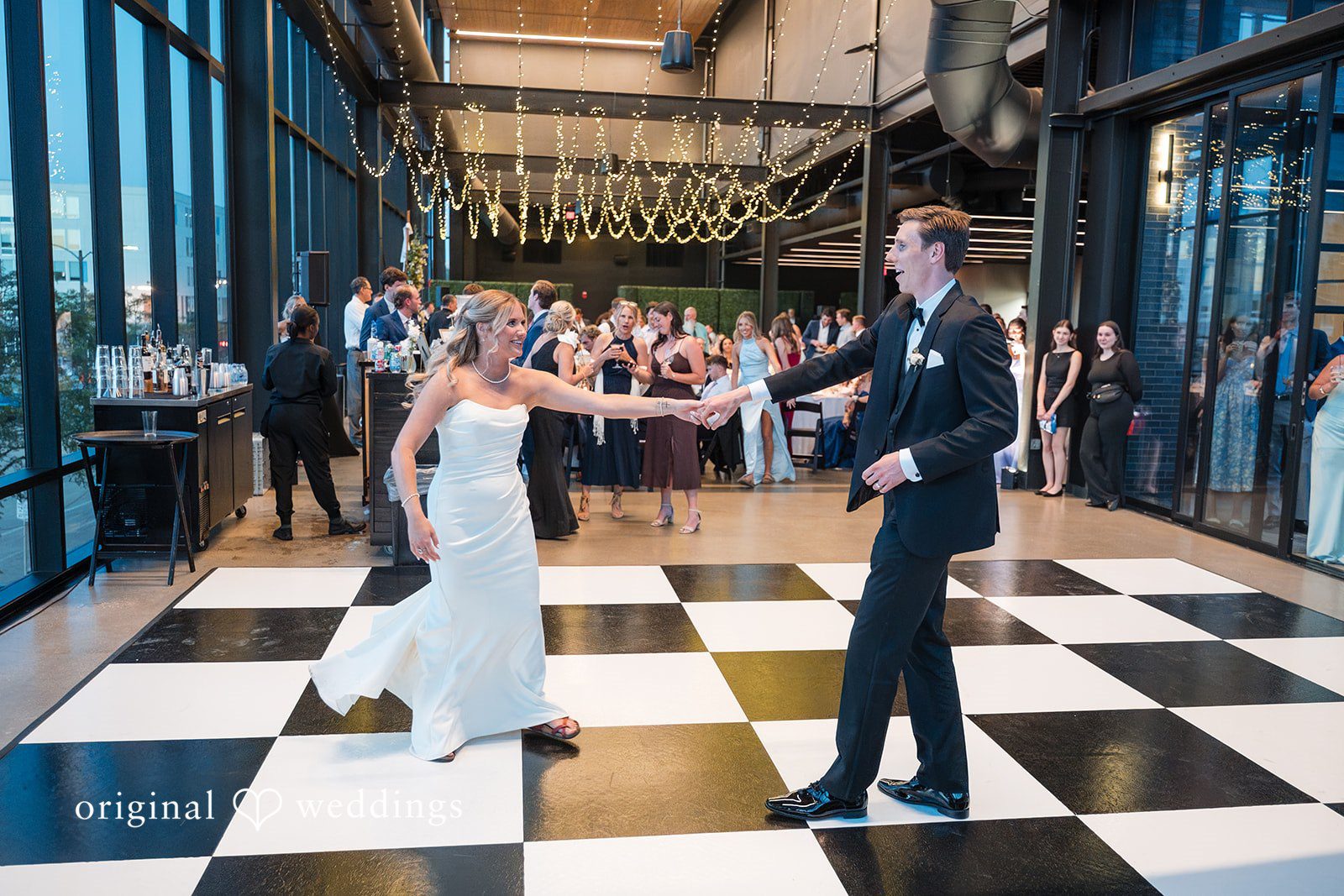 Lovely couple sharing  a dance with the guests around