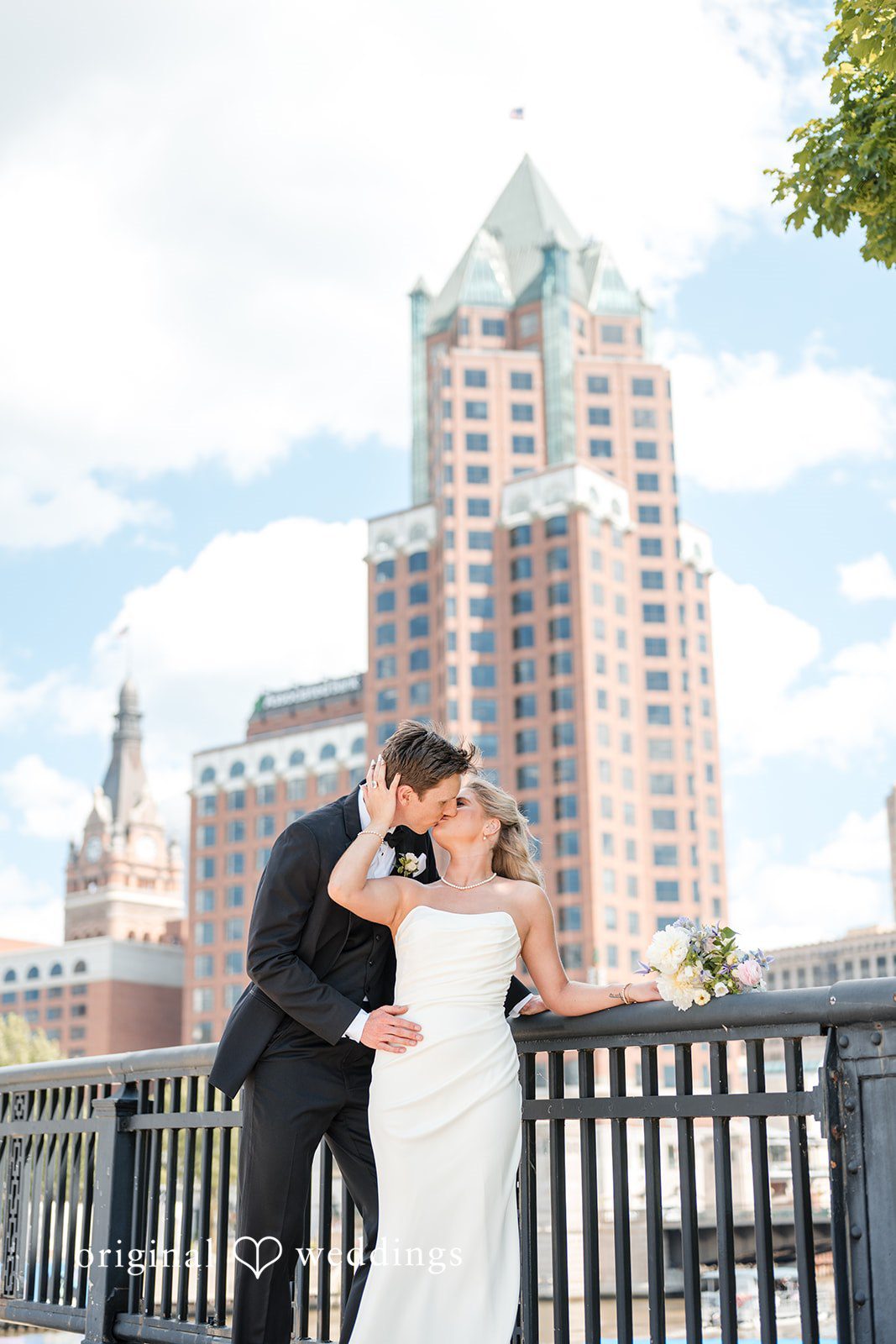 Romantic kiss moment of couple at Gather at Deer District captured by Milwaukee wedding photographers from Original Weddings