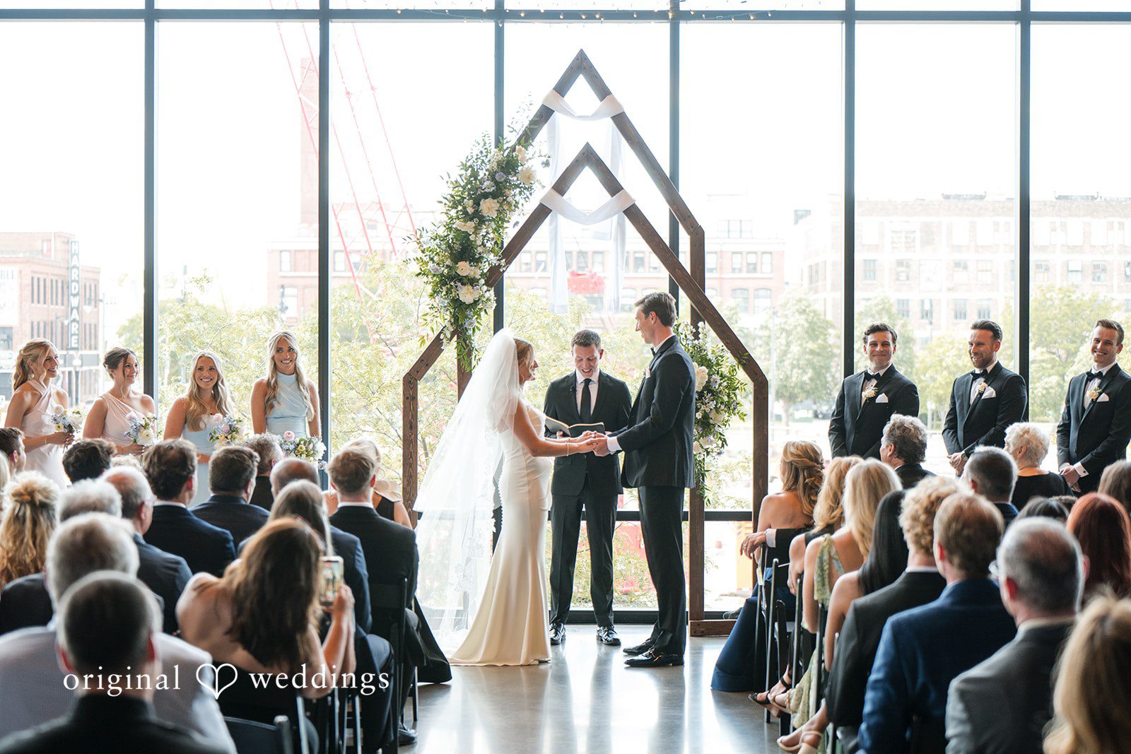 Couple exchanging vows during elegant wedding ceremony at Gather at Deer District