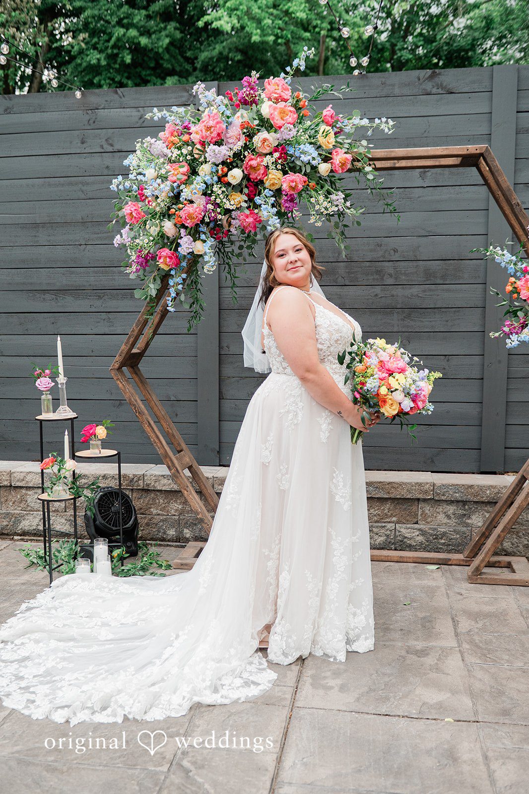 Janissa + Josh Stunning portrait of bride at the altar holding bouquet
