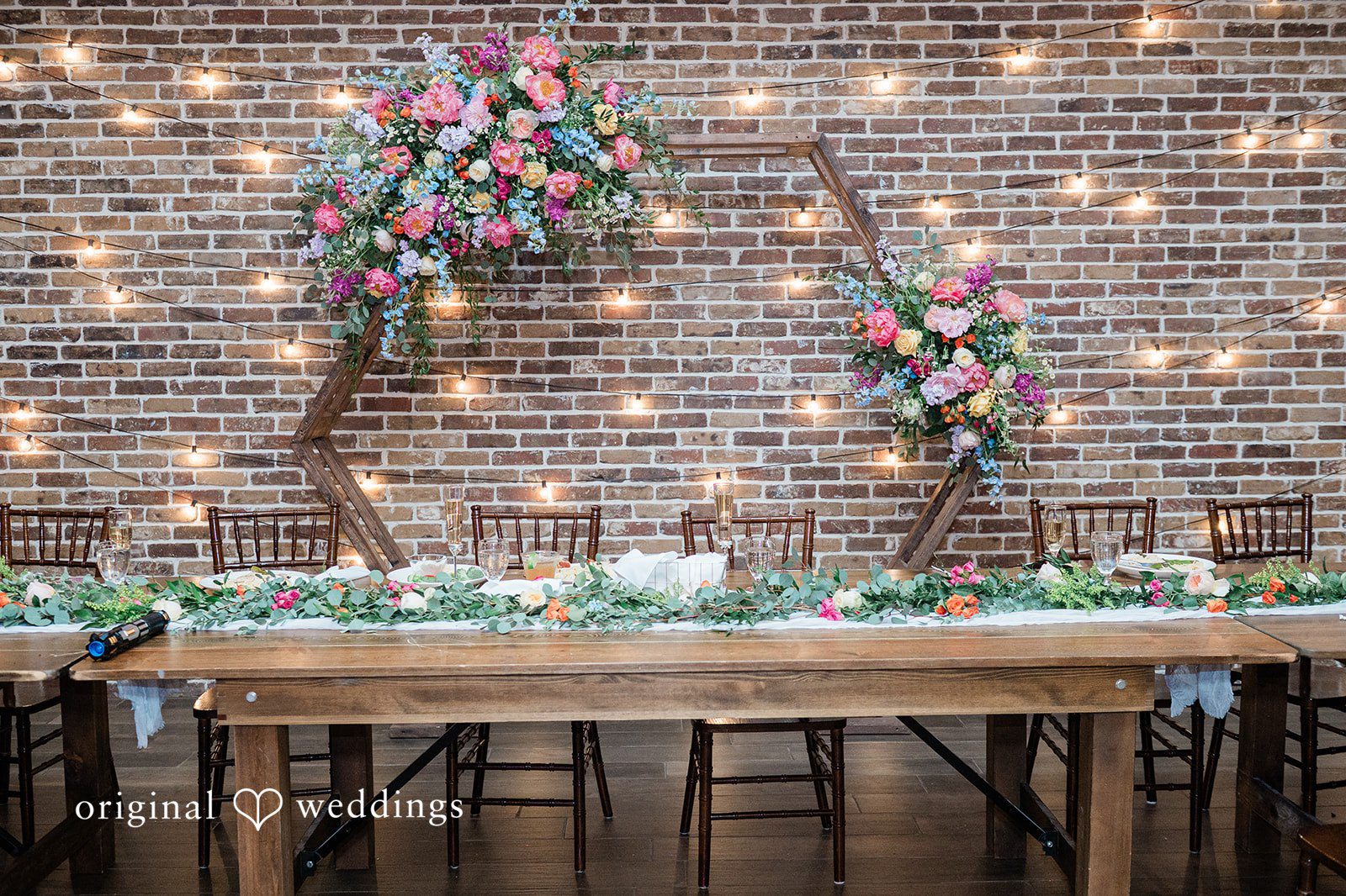 Janissa + Josh Decorated wedding tables with flowers at Gather at the Lakes