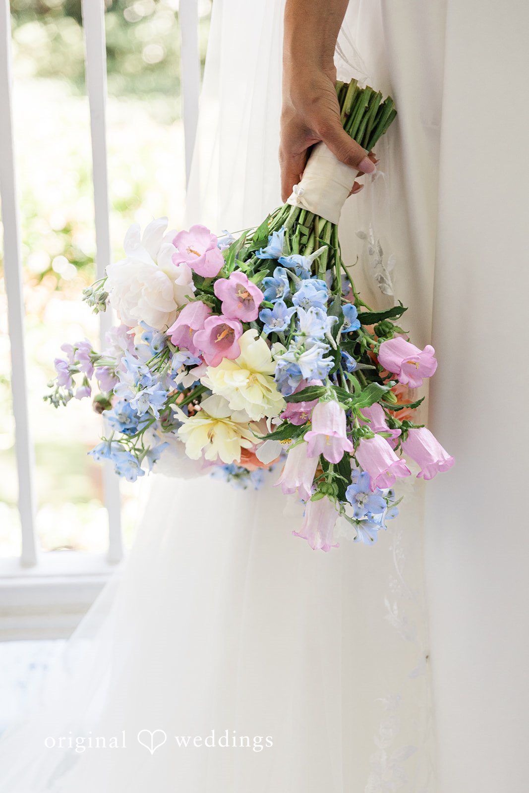 A close-up shot of the bride holding her bouquet