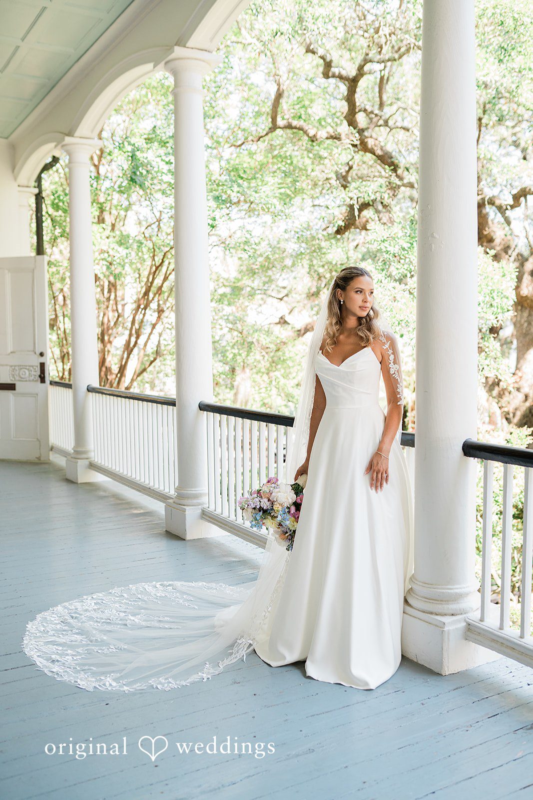 A stunning portrait of the bride by the gallery