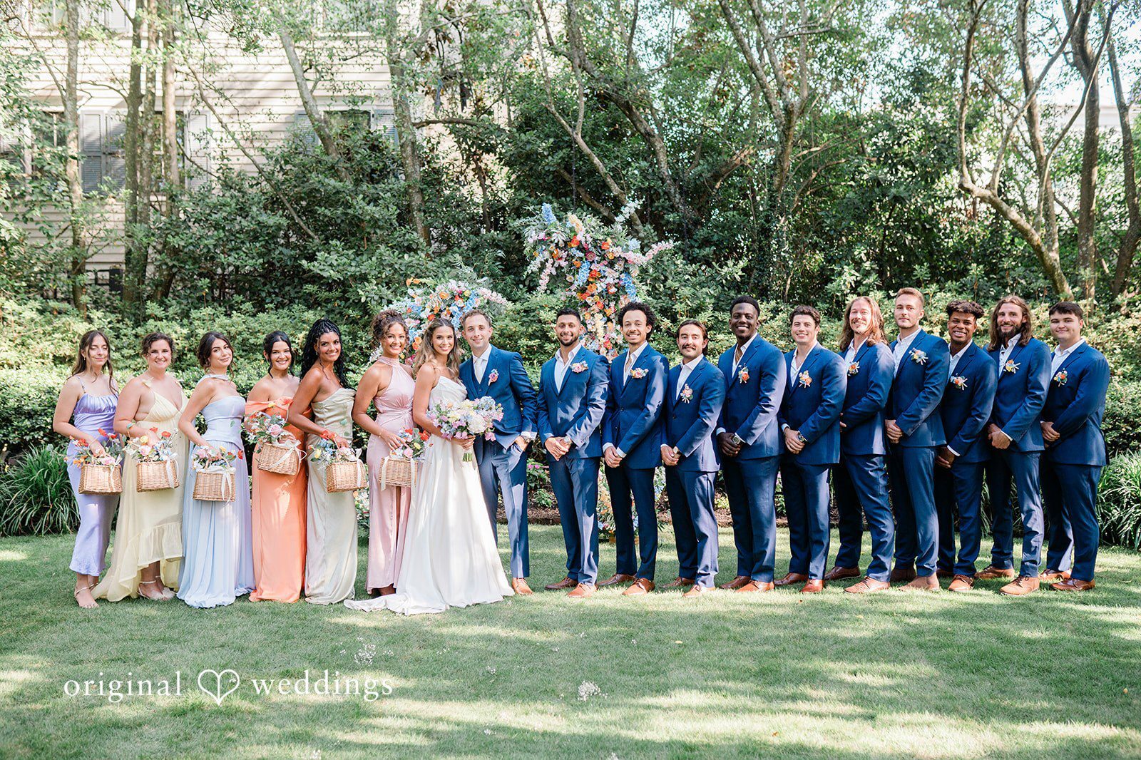 Our Charleston wedding photographers at Original Weddings captured a stunning portrait of the couple and their bridal party at the Governor Thomas Bennett House