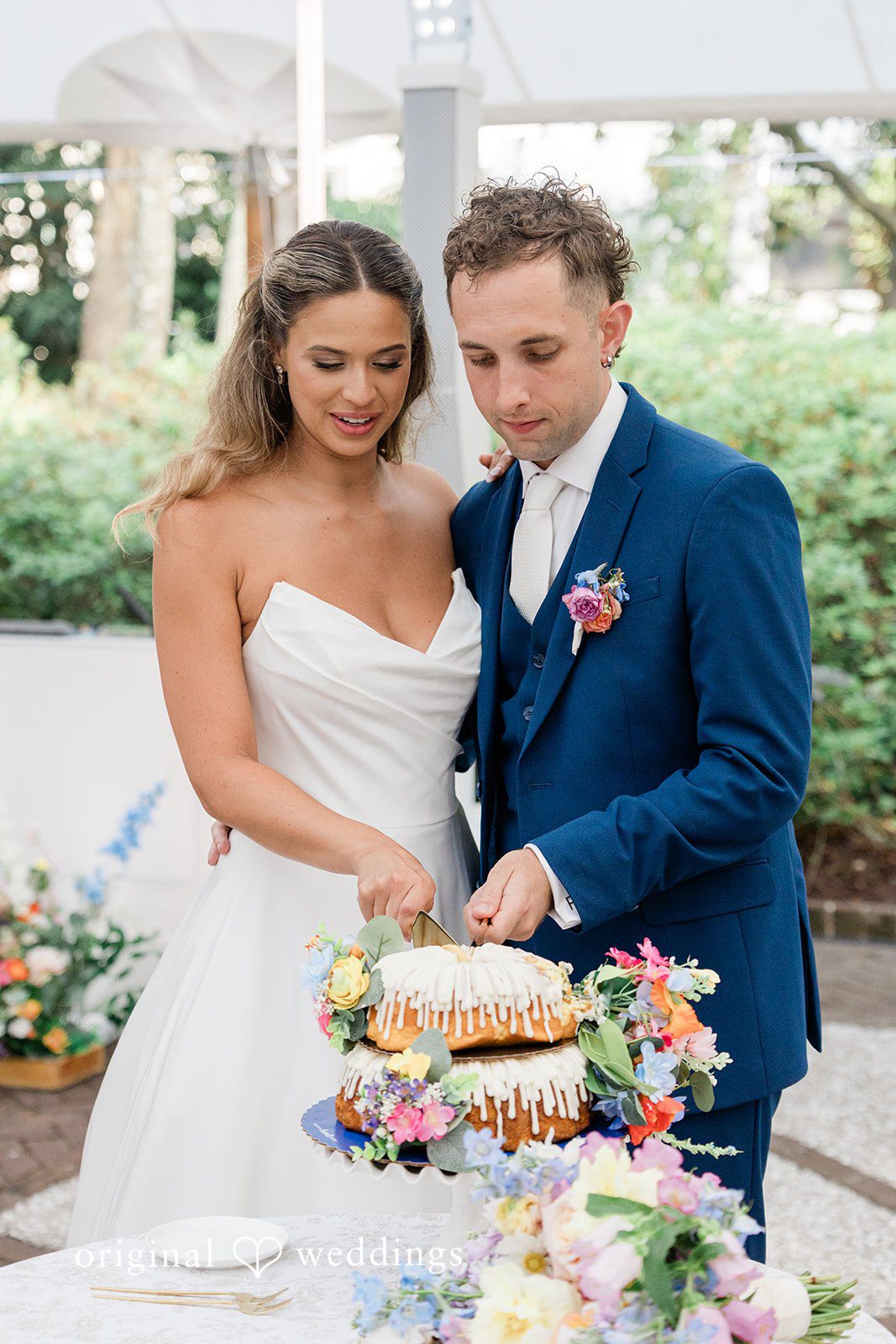 The couple cuts their cake