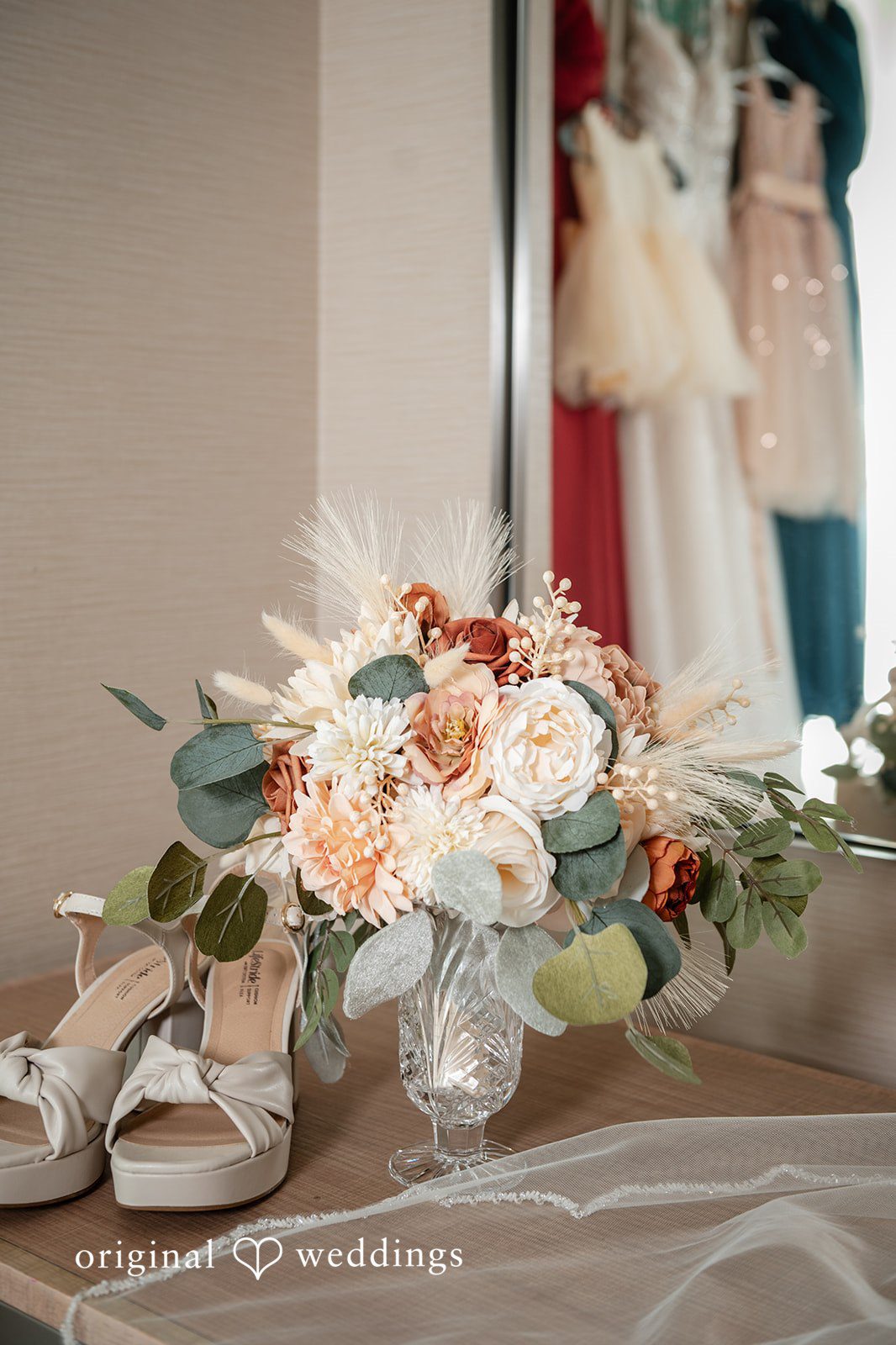 Sara + Austin Bridal shoes placed beside decorative vase
