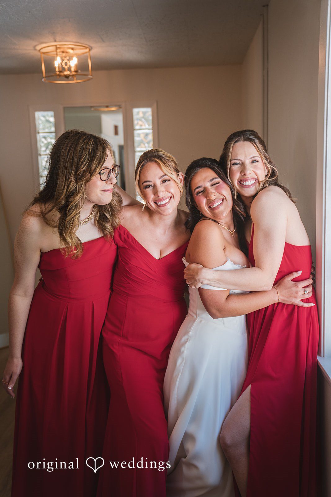 Raena + Austin A happy portrait of the bride and her bridesmaids