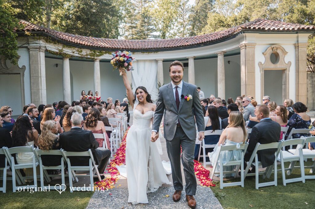 Raena + Austin Our San Francisco wedding photographers captured a joyful portrait of the couple after the vows exchange at Hacienda De Las Flores