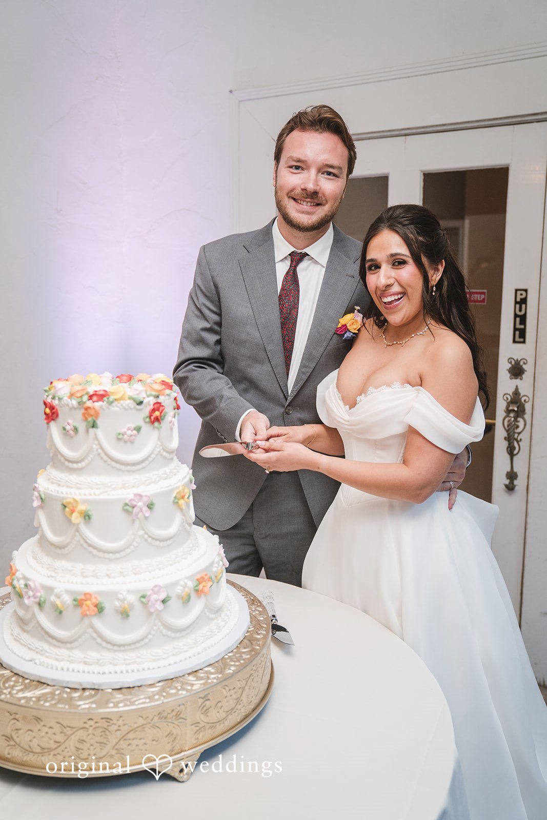 Raena + Austin The couple is about to cut the wedding cake
