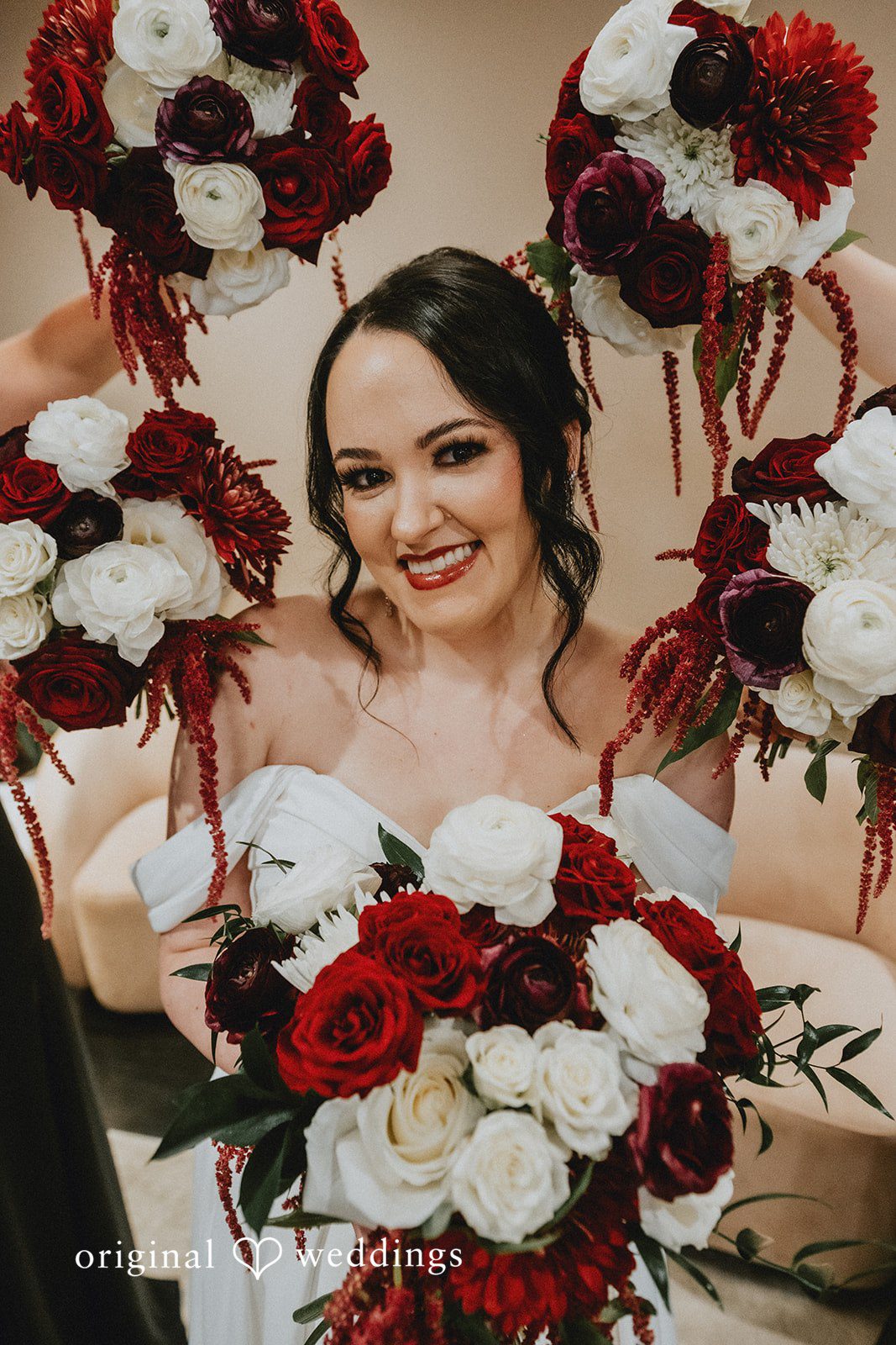 Christina + Josue A stylish portrait of the bride wrapped in fresh blooms