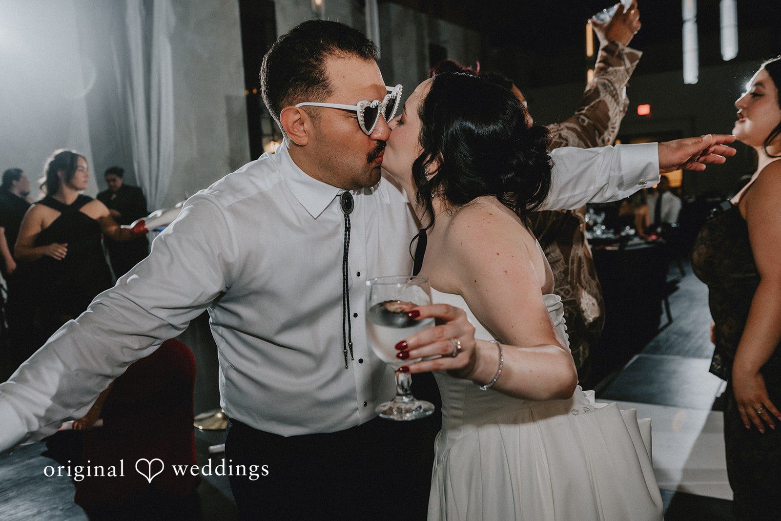 Christina + Josue The couple shares a kiss