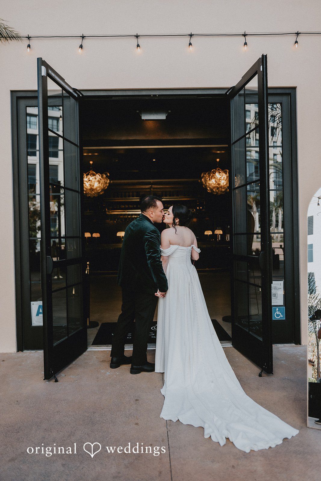 Christina + Josue A romantic portrait of the couple at the wedding venue