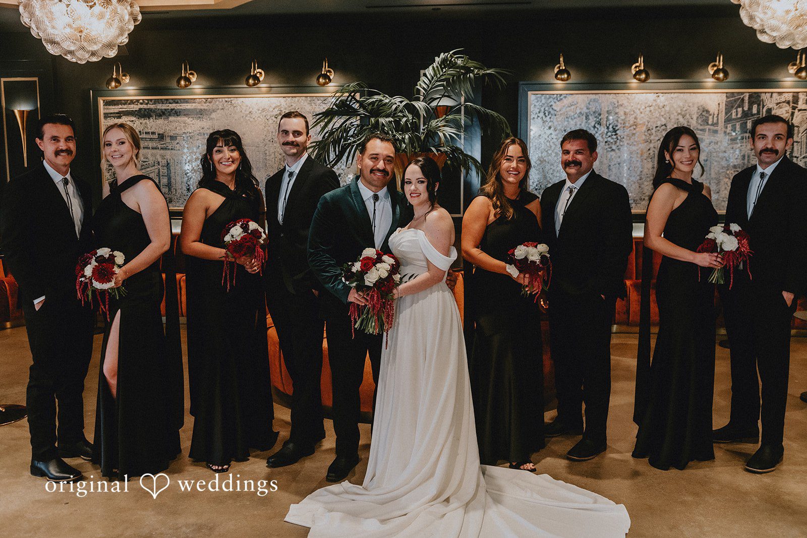 Christina + Josue Our San Diego wedding photographers at Original Weddings captured a stunning portrait of the couple and their bridal party at the Headquarters at Wedgewood