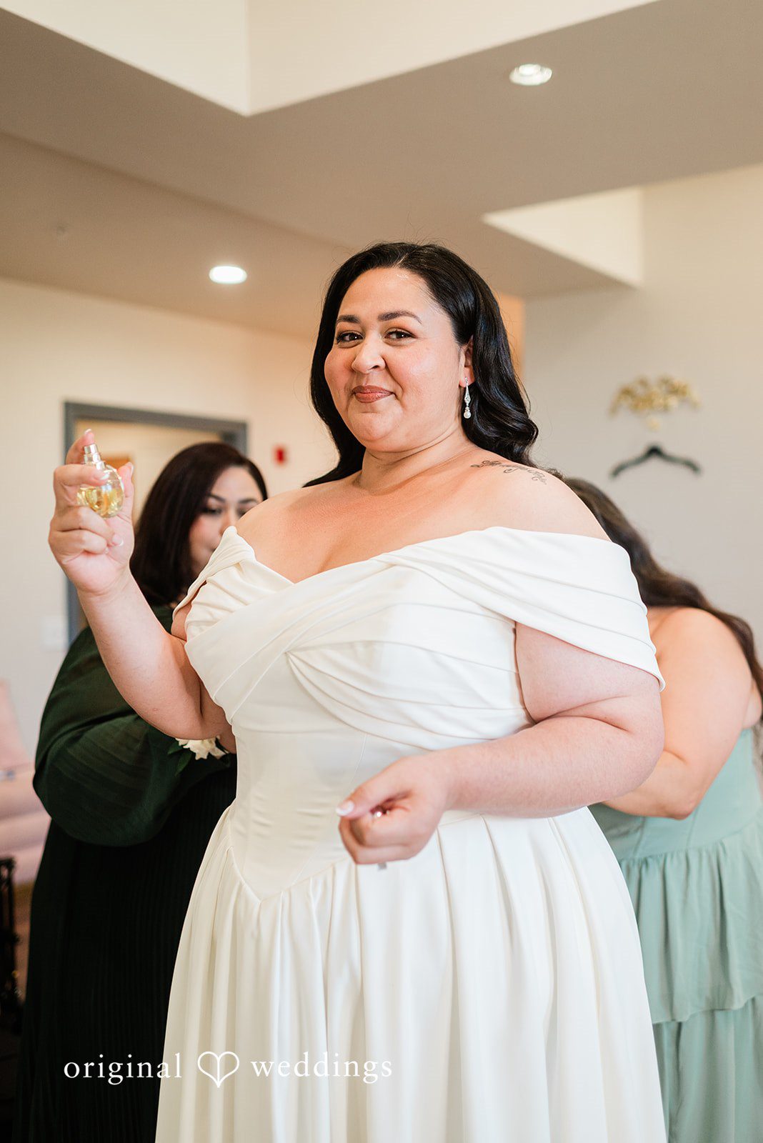 Getting ready picture of bride with someone