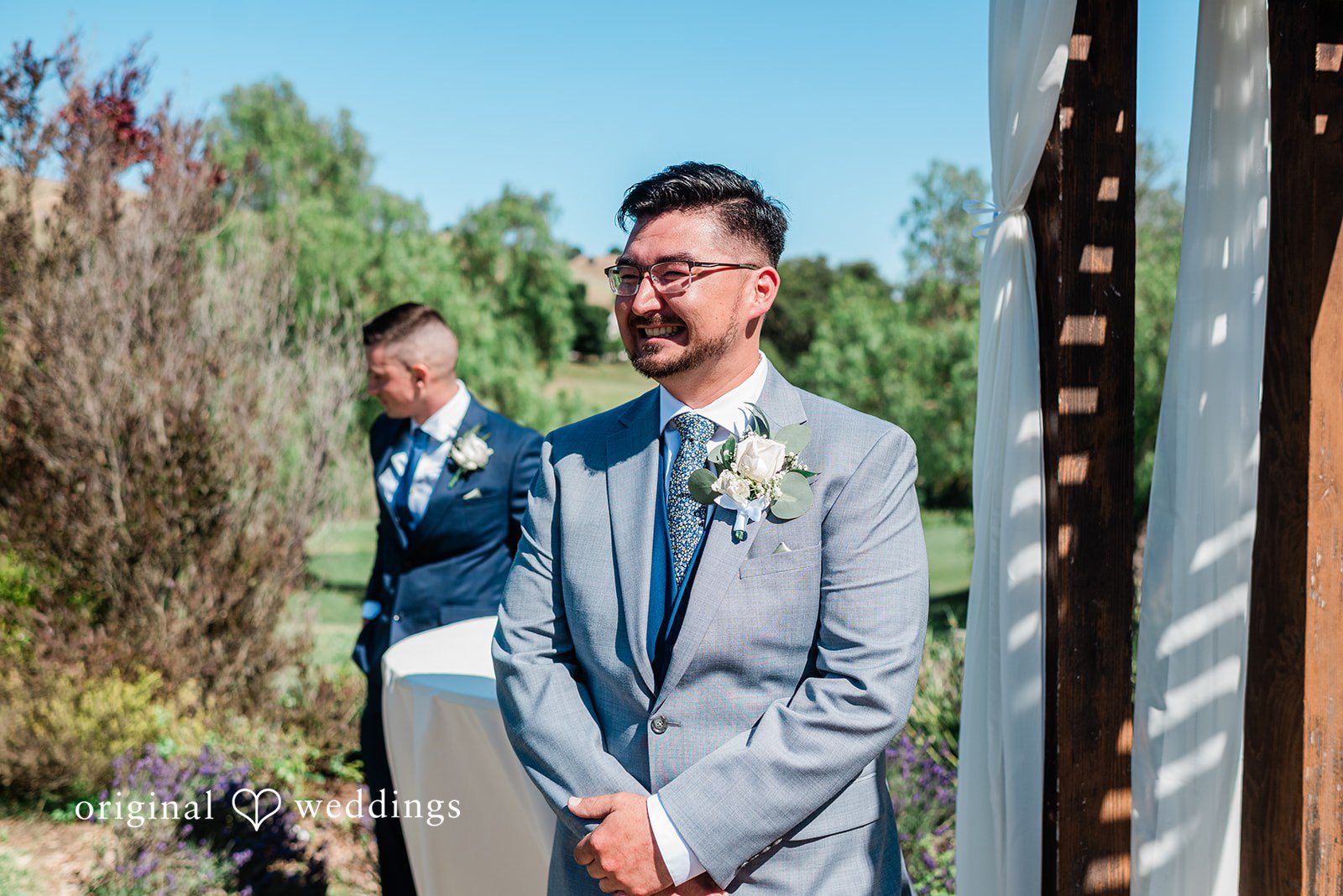 Groom looking for the bride with happiness