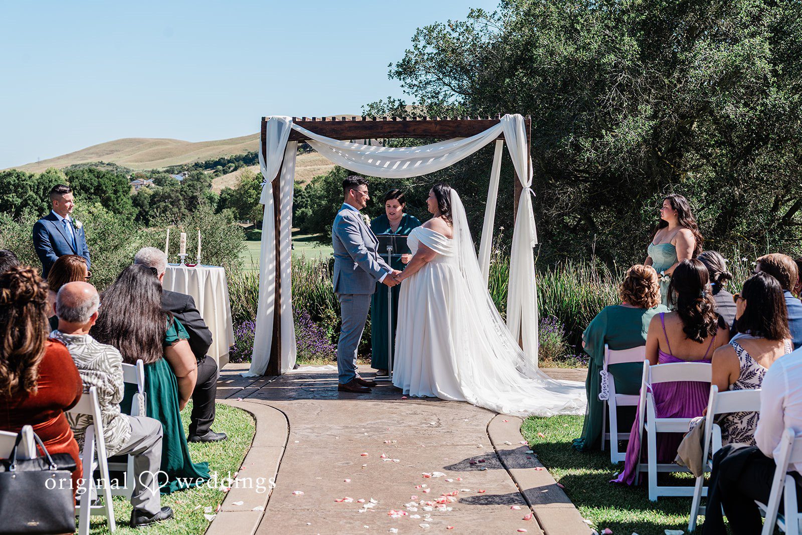 Couple exchanging vows during ceremony at Hiddenbrooke Hills