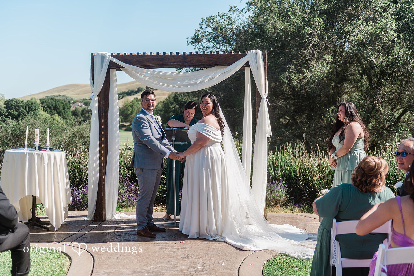 Couple exchanging vows during ceremony at Hiddenbrooke Hills
