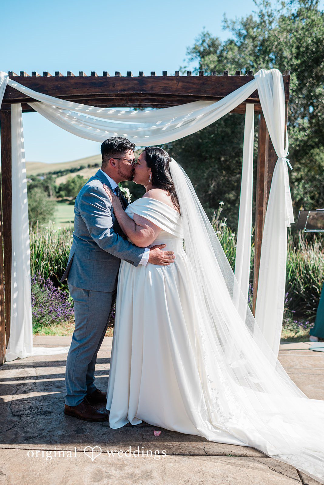 Romantic first kiss moment of the couple captured by San Francisco Wedding Photographers