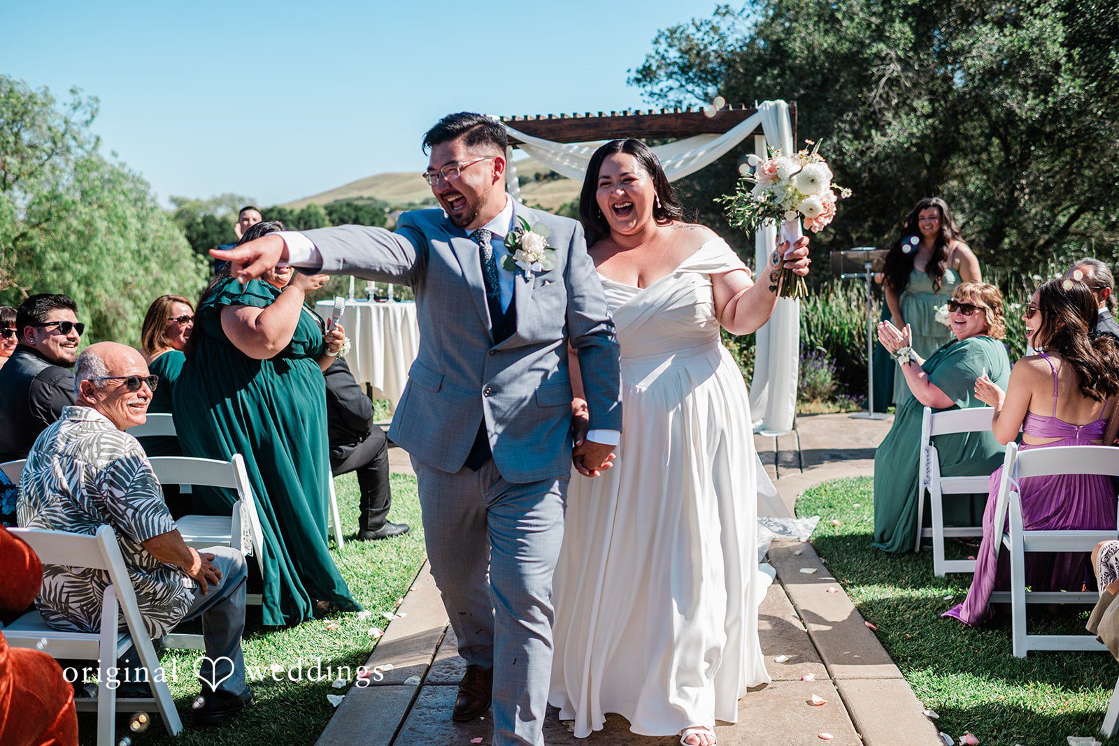 Couple leaving the altar with happiness