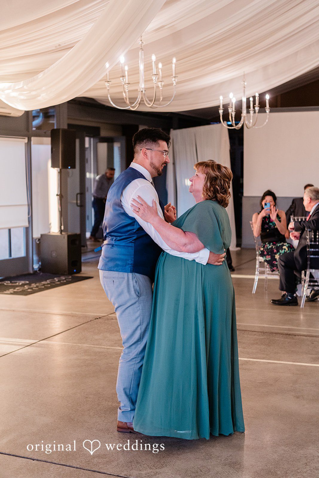 Groom sharing a dance with a woman