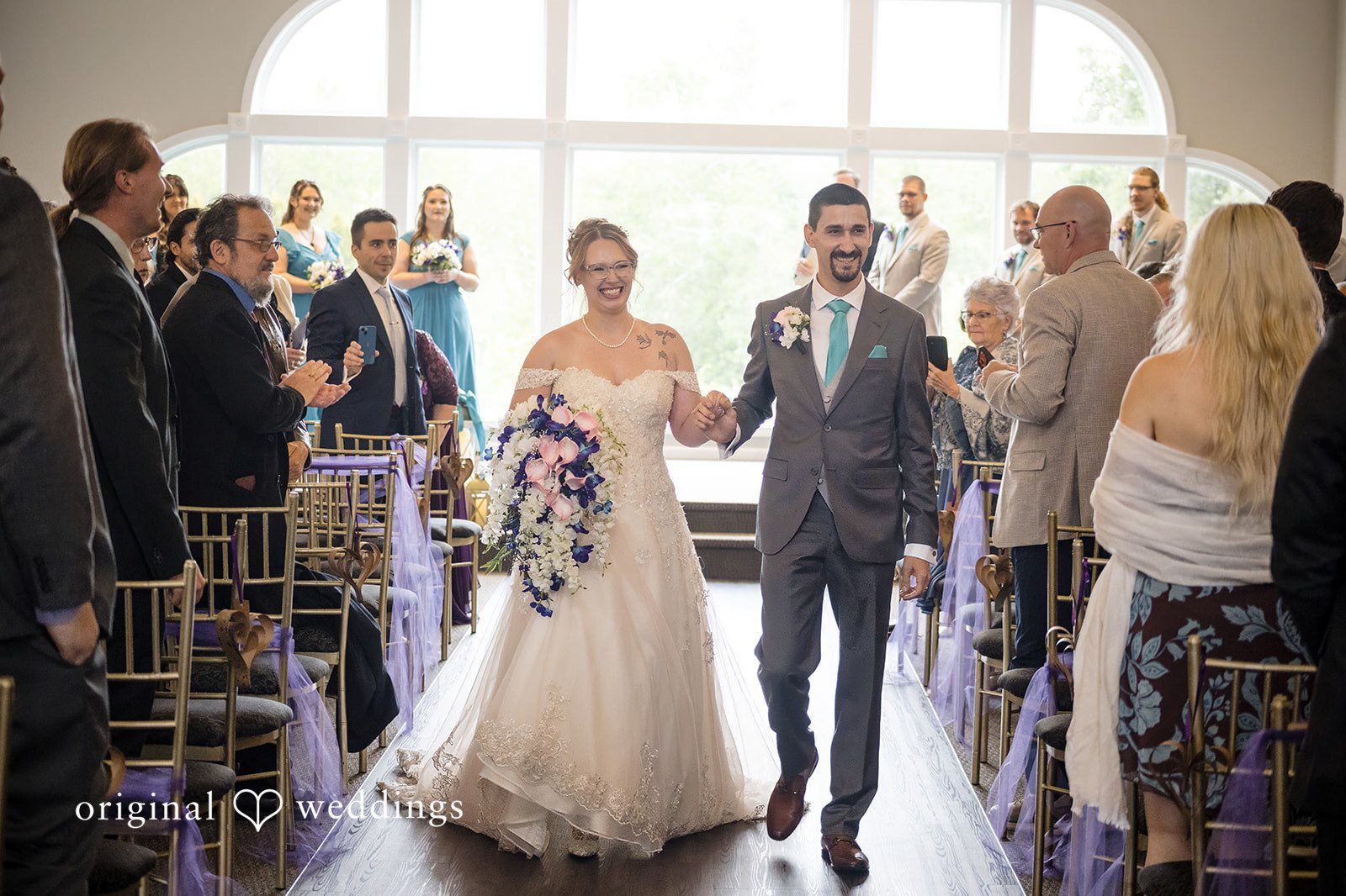 Our Hartford CT wedding photographers at Original Weddings captured the moment the couple made a joyful exit after the wedding ceremony at High Point Gardens