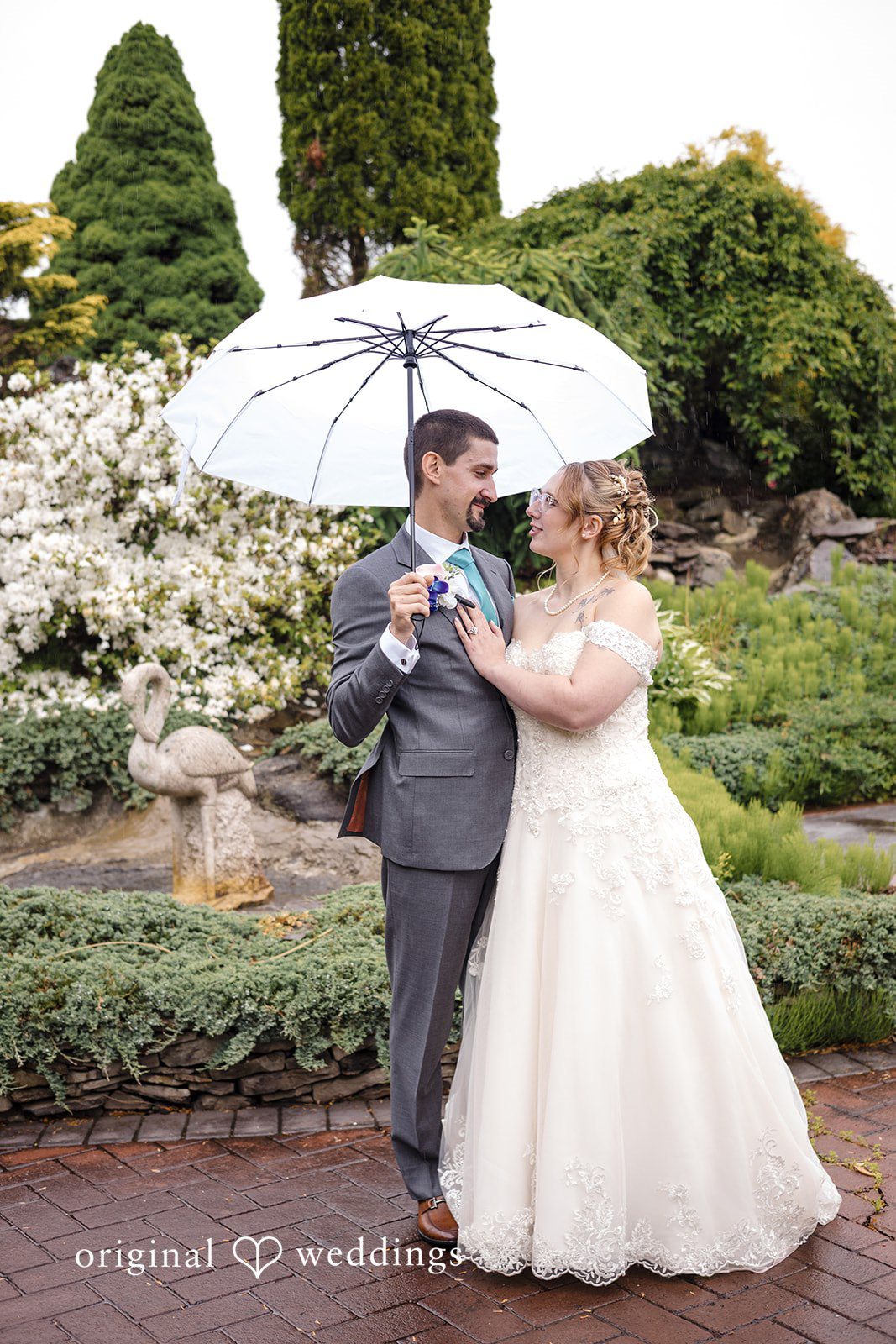 Madison + Edin The couple takes a shot under their umbrella