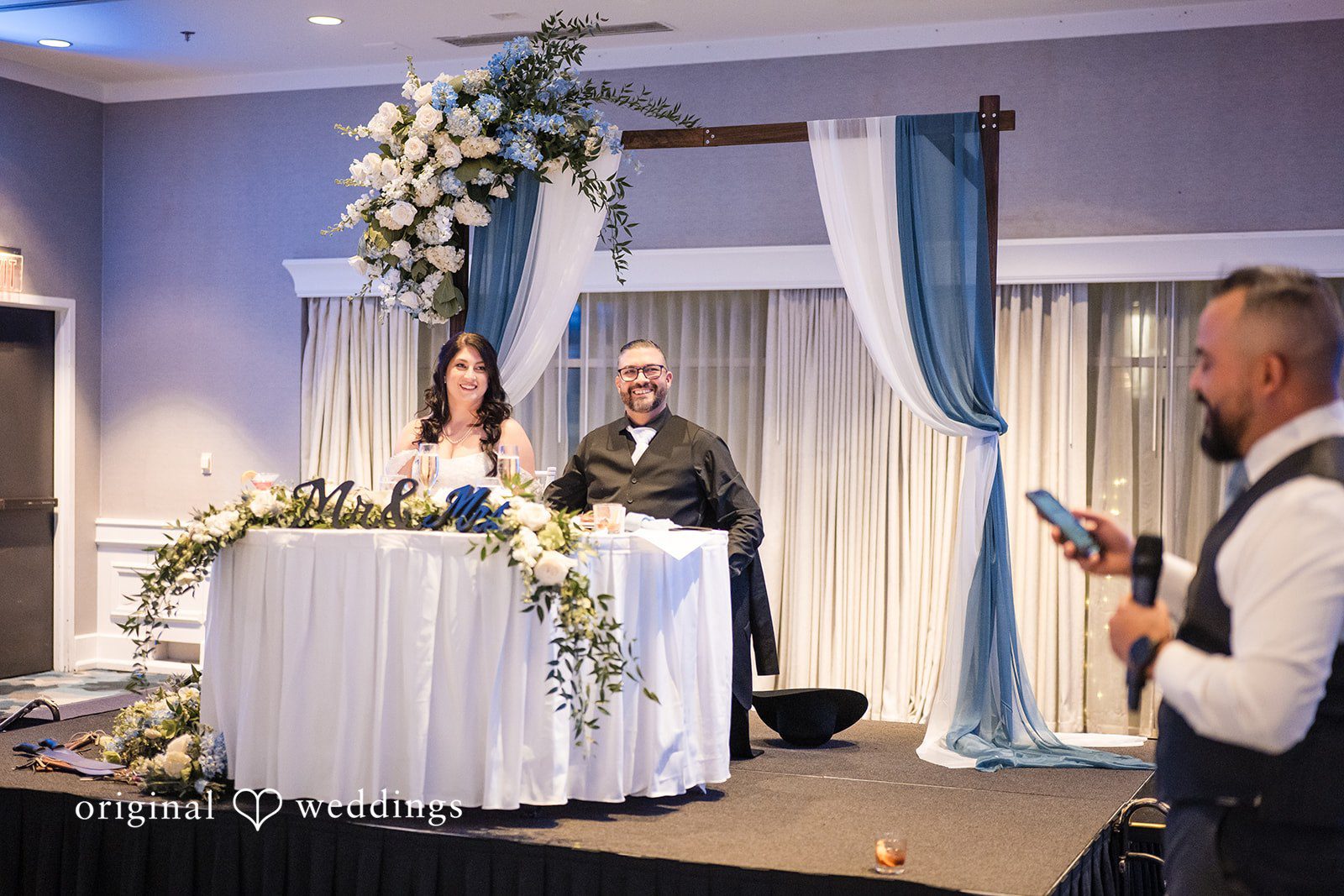 Peter + Aimee Portland Wedding Photographers capturing couple seated at reception table at Hilton Portland Downtown by Original Weddings