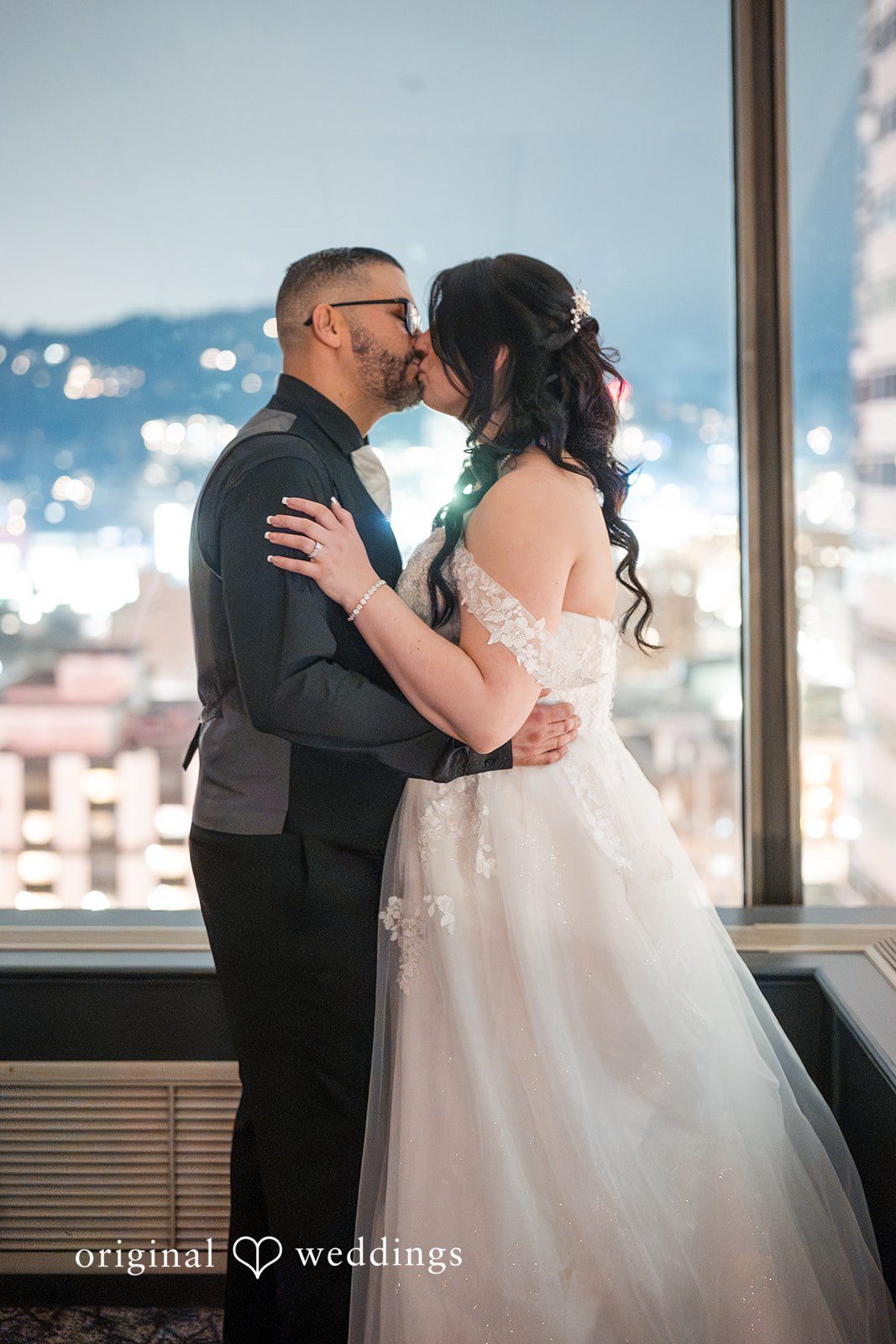 Peter + Aimee Elegant bride and groom kiss photography at Hilton Portland Downtown