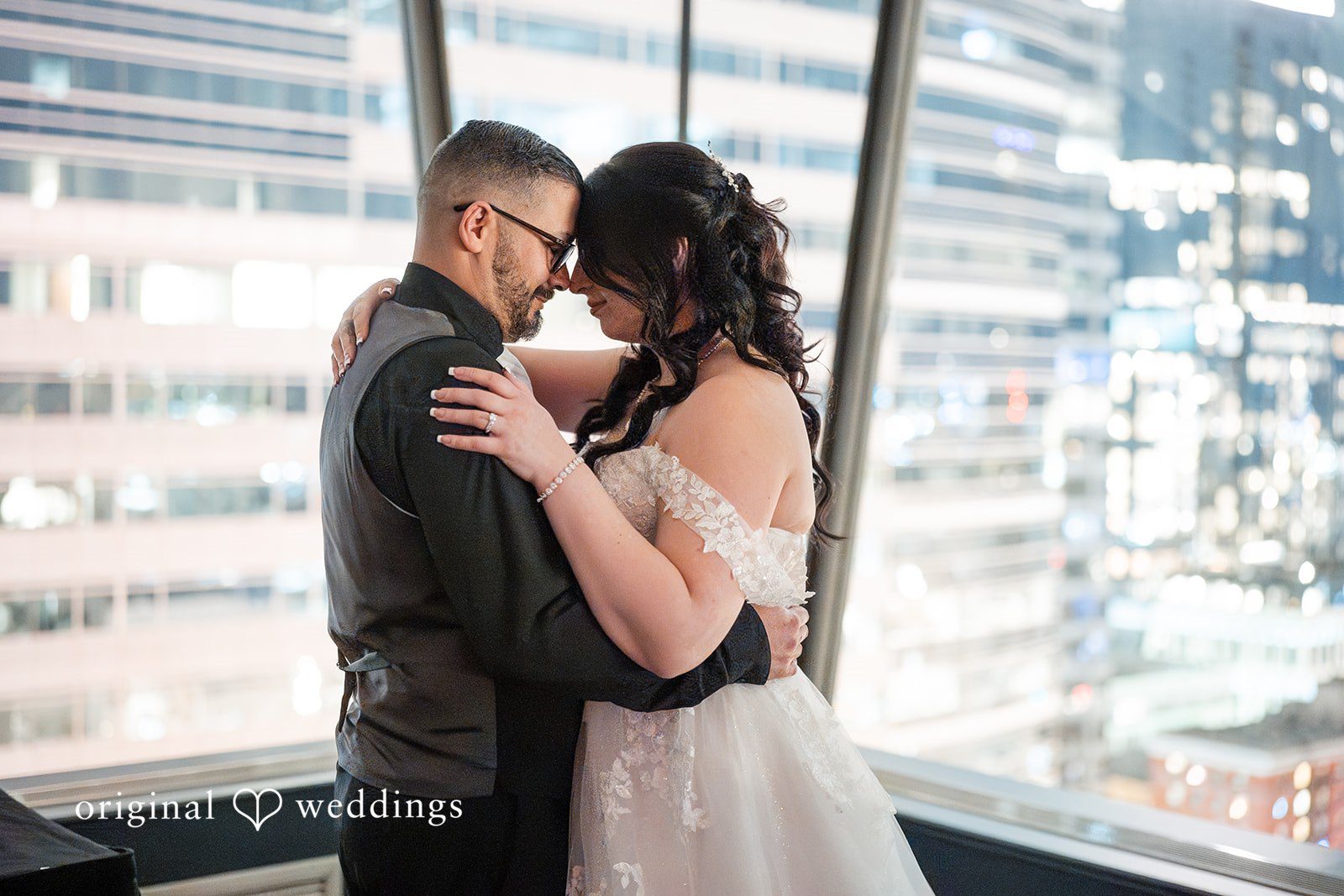 Peter + Aimee Portland wedding photographers capturing couple touching foreheads at Hilton Portland Downtown by Original Weddings