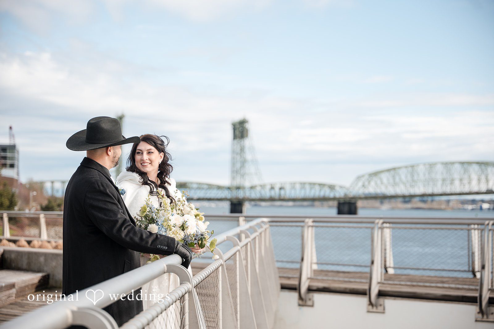 Peter + Aimee Portland Wedding Photographers capturing couple looking at each other while smiling at Hilton Portland Downtown by Original Weddings