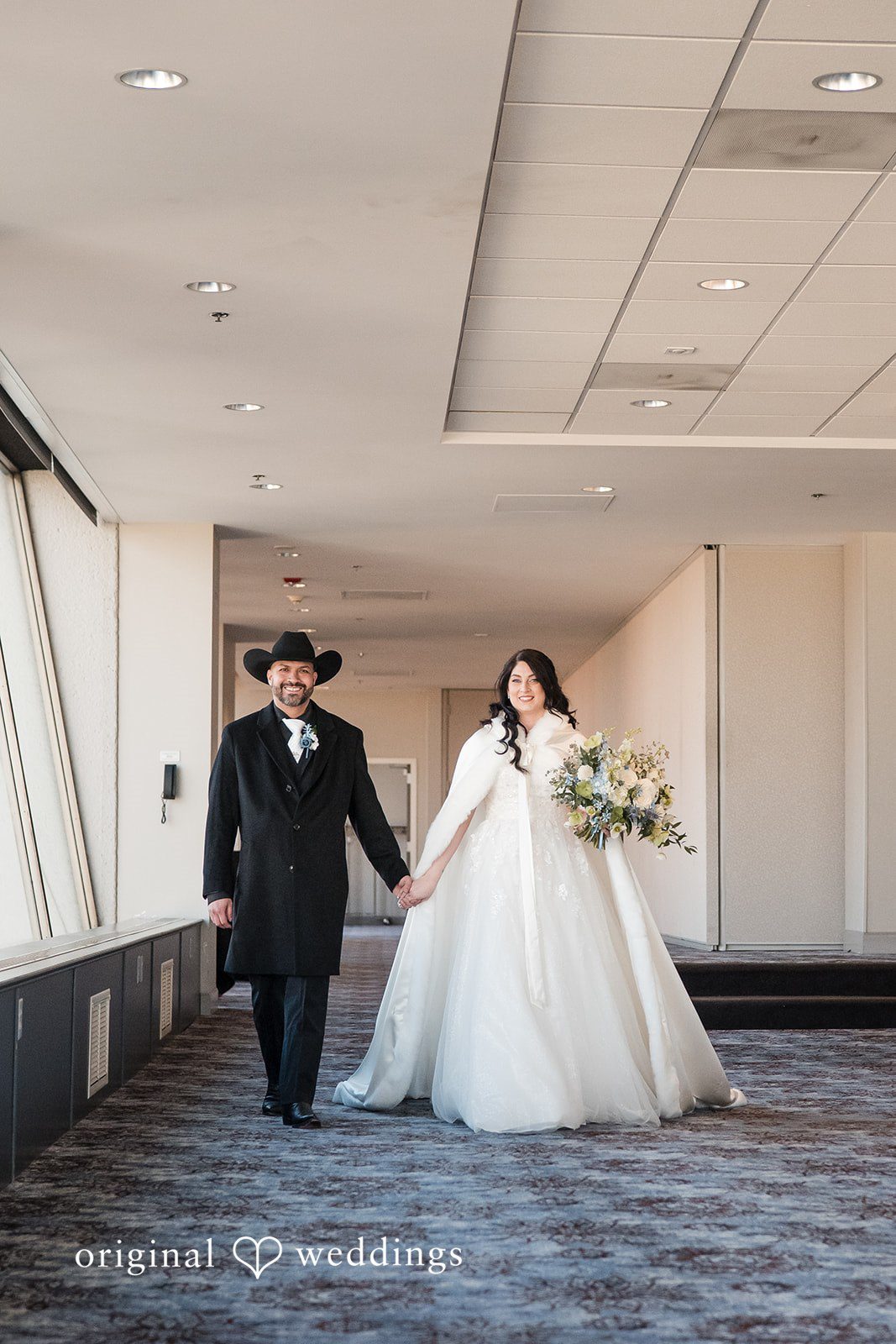 Peter + Aimee Joyful reception entrance moment while holding hands at Hilton Portland Downtown