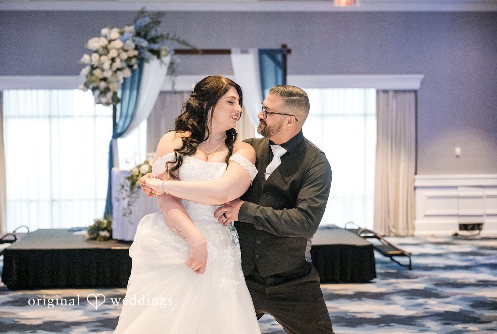 Portland wedding photographers by Original Weddings capturing romantic couple photo while looking at each other at Hilton Portland Downtown