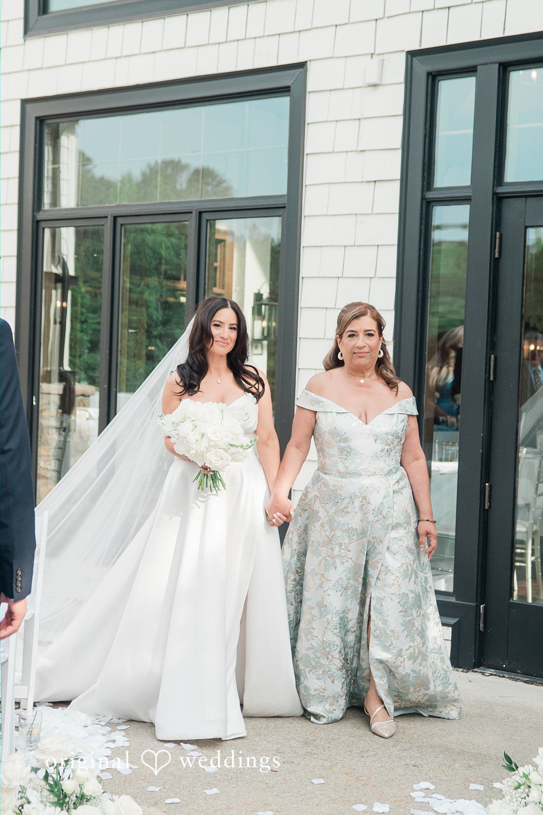 Anna + Blake Bride walking down the aisle with someone