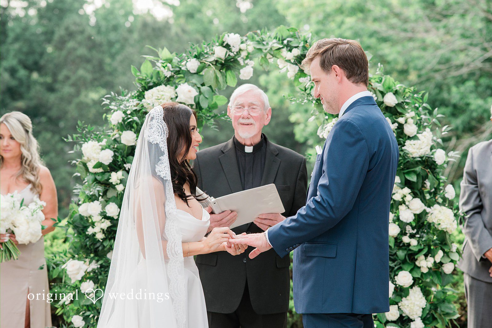 Anna + Blake Bride and groom exchanging the wedding rings during the ceremony