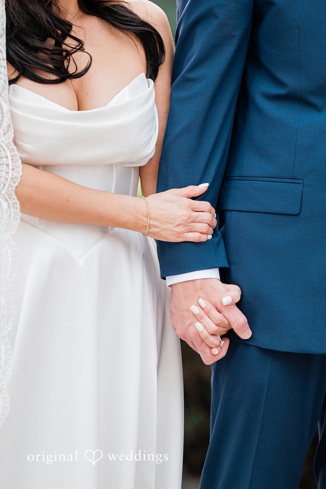 Anna + Blake Bride and groom holding hands at Iron Horse Golf Club