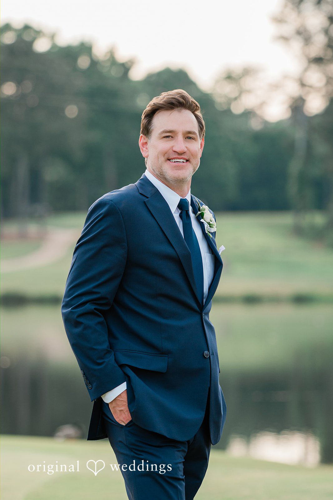 Anna + Blake Groom posing at Iron Horse Golf Club for wedding photography