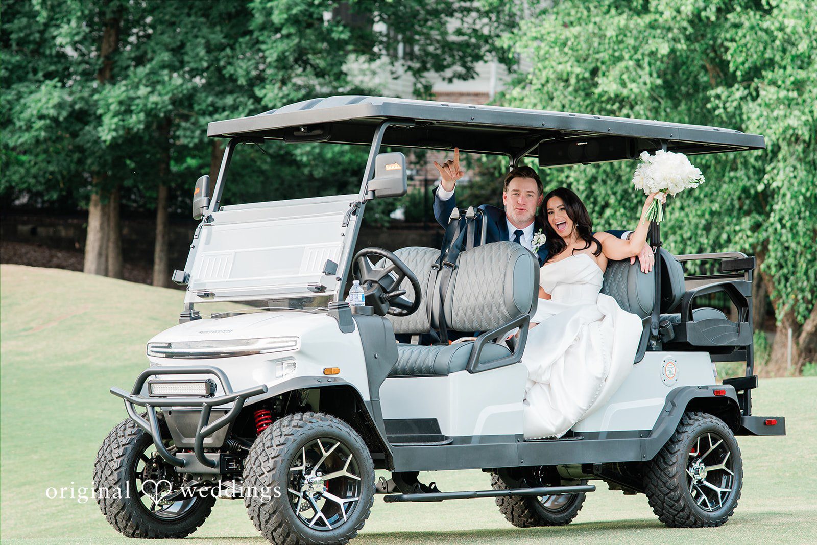 Anna + Blake Bride and groom ride in a golf cart at their Iron Horse Golf Club wedding