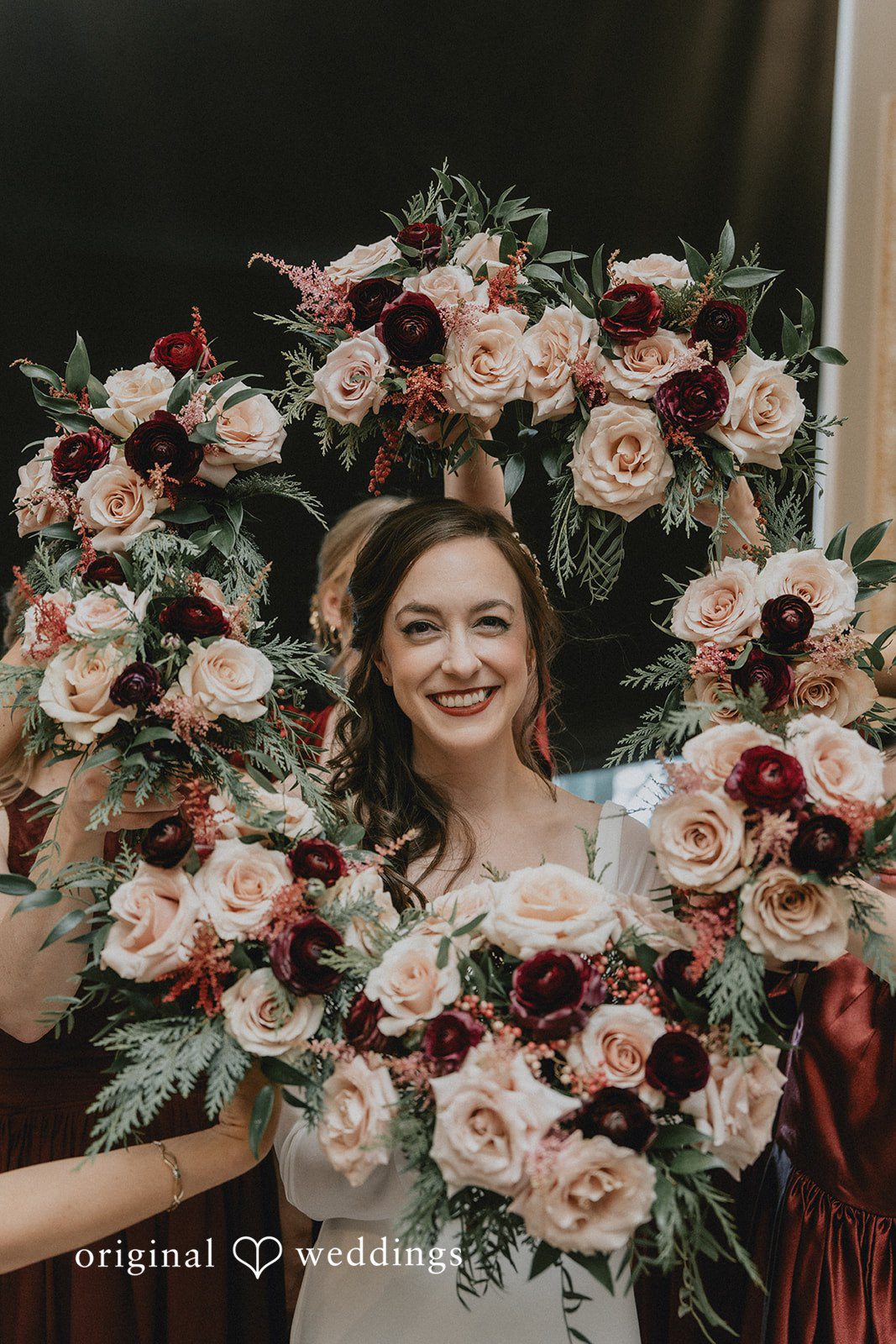 Spencer + Hilary A portrait of the bride wrapped in fresh blooms