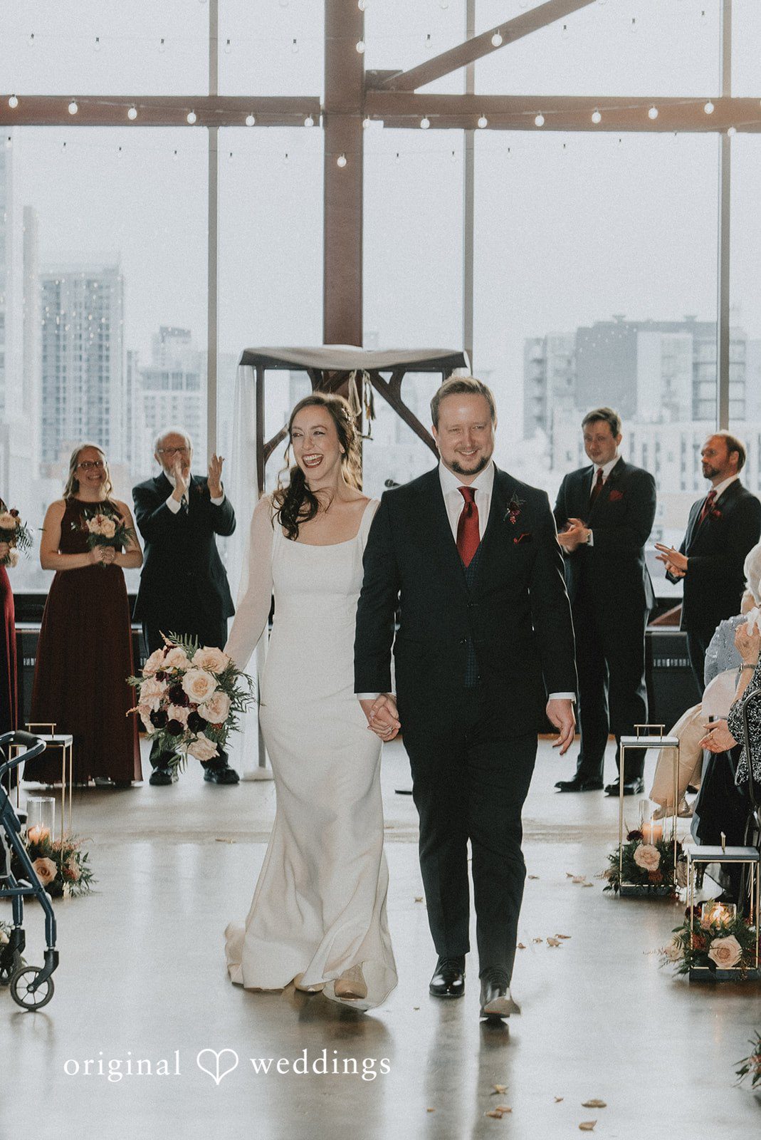 Spencer + Hilary The couple walks through the aisle joyfully